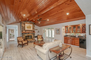 Spacious Coastal Retreat with Sunroom & Outdoor Entertaining on Brick Landing Plantation Yacht and Golf Club in North Carolina - for sale on GolfHomes.com, golf home, golf lot