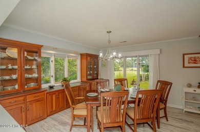 Spacious Coastal Retreat with Sunroom & Outdoor Entertaining on Brick Landing Plantation Yacht and Golf Club in North Carolina - for sale on GolfHomes.com, golf home, golf lot