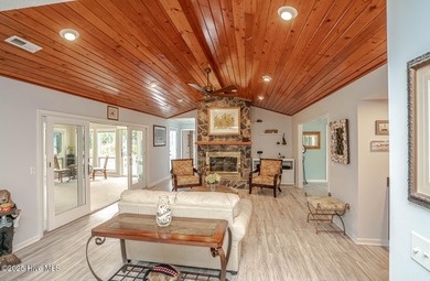 Spacious Coastal Retreat with Sunroom & Outdoor Entertaining on Brick Landing Plantation Yacht and Golf Club in North Carolina - for sale on GolfHomes.com, golf home, golf lot