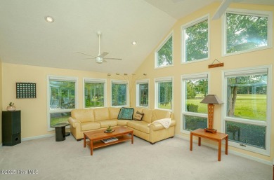 Spacious Coastal Retreat with Sunroom & Outdoor Entertaining on Brick Landing Plantation Yacht and Golf Club in North Carolina - for sale on GolfHomes.com, golf home, golf lot