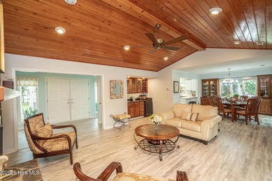 Spacious Coastal Retreat with Sunroom & Outdoor Entertaining on Brick Landing Plantation Yacht and Golf Club in North Carolina - for sale on GolfHomes.com, golf home, golf lot