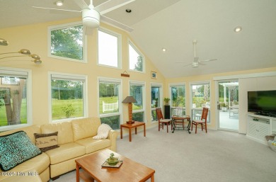 Spacious Coastal Retreat with Sunroom & Outdoor Entertaining on Brick Landing Plantation Yacht and Golf Club in North Carolina - for sale on GolfHomes.com, golf home, golf lot