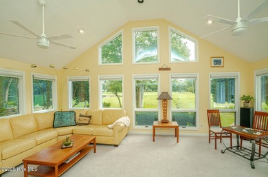 Spacious Coastal Retreat with Sunroom & Outdoor Entertaining on Brick Landing Plantation Yacht and Golf Club in North Carolina - for sale on GolfHomes.com, golf home, golf lot