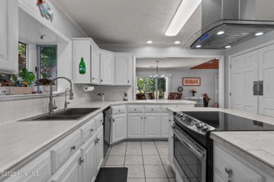 Spacious Coastal Retreat with Sunroom & Outdoor Entertaining on Brick Landing Plantation Yacht and Golf Club in North Carolina - for sale on GolfHomes.com, golf home, golf lot