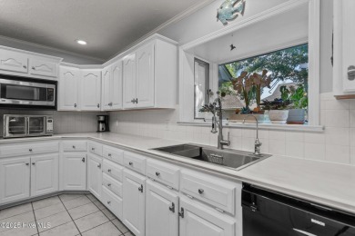 Spacious Coastal Retreat with Sunroom & Outdoor Entertaining on Brick Landing Plantation Yacht and Golf Club in North Carolina - for sale on GolfHomes.com, golf home, golf lot