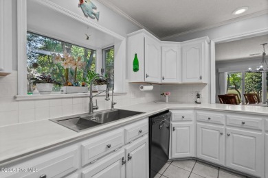 Spacious Coastal Retreat with Sunroom & Outdoor Entertaining on Brick Landing Plantation Yacht and Golf Club in North Carolina - for sale on GolfHomes.com, golf home, golf lot