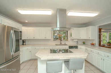 Spacious Coastal Retreat with Sunroom & Outdoor Entertaining on Brick Landing Plantation Yacht and Golf Club in North Carolina - for sale on GolfHomes.com, golf home, golf lot