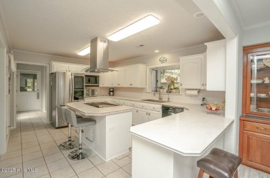 Spacious Coastal Retreat with Sunroom & Outdoor Entertaining on Brick Landing Plantation Yacht and Golf Club in North Carolina - for sale on GolfHomes.com, golf home, golf lot