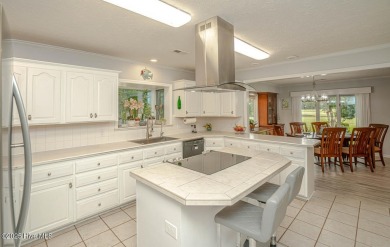 Spacious Coastal Retreat with Sunroom & Outdoor Entertaining on Brick Landing Plantation Yacht and Golf Club in North Carolina - for sale on GolfHomes.com, golf home, golf lot
