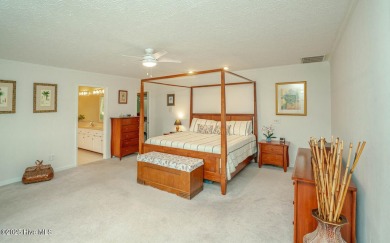 Spacious Coastal Retreat with Sunroom & Outdoor Entertaining on Brick Landing Plantation Yacht and Golf Club in North Carolina - for sale on GolfHomes.com, golf home, golf lot