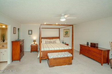 Spacious Coastal Retreat with Sunroom & Outdoor Entertaining on Brick Landing Plantation Yacht and Golf Club in North Carolina - for sale on GolfHomes.com, golf home, golf lot