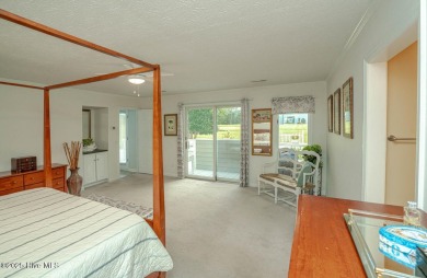 Spacious Coastal Retreat with Sunroom & Outdoor Entertaining on Brick Landing Plantation Yacht and Golf Club in North Carolina - for sale on GolfHomes.com, golf home, golf lot