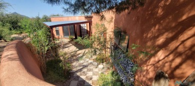 This Santa Fe style home is absolutely charming and rich in on Sierra Del Rio Golf Club in New Mexico - for sale on GolfHomes.com, golf home, golf lot