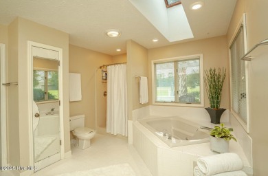 Spacious Coastal Retreat with Sunroom & Outdoor Entertaining on Brick Landing Plantation Yacht and Golf Club in North Carolina - for sale on GolfHomes.com, golf home, golf lot
