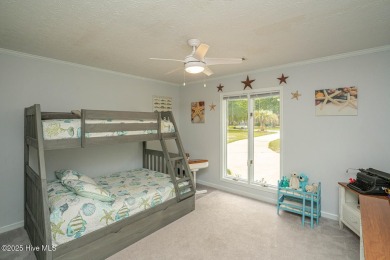 Spacious Coastal Retreat with Sunroom & Outdoor Entertaining on Brick Landing Plantation Yacht and Golf Club in North Carolina - for sale on GolfHomes.com, golf home, golf lot