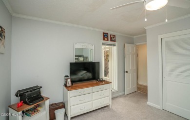 Spacious Coastal Retreat with Sunroom & Outdoor Entertaining on Brick Landing Plantation Yacht and Golf Club in North Carolina - for sale on GolfHomes.com, golf home, golf lot