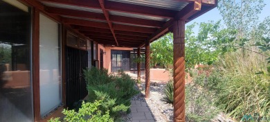 This Santa Fe style home is absolutely charming and rich in on Sierra Del Rio Golf Club in New Mexico - for sale on GolfHomes.com, golf home, golf lot