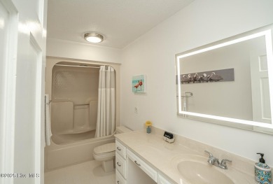 Spacious Coastal Retreat with Sunroom & Outdoor Entertaining on Brick Landing Plantation Yacht and Golf Club in North Carolina - for sale on GolfHomes.com, golf home, golf lot