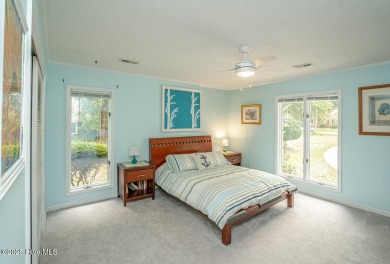 Spacious Coastal Retreat with Sunroom & Outdoor Entertaining on Brick Landing Plantation Yacht and Golf Club in North Carolina - for sale on GolfHomes.com, golf home, golf lot