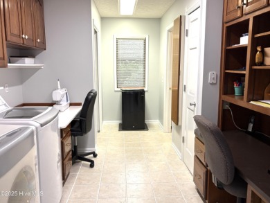 Spacious Coastal Retreat with Sunroom & Outdoor Entertaining on Brick Landing Plantation Yacht and Golf Club in North Carolina - for sale on GolfHomes.com, golf home, golf lot