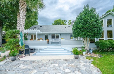 Spacious Coastal Retreat with Sunroom & Outdoor Entertaining on Brick Landing Plantation Yacht and Golf Club in North Carolina - for sale on GolfHomes.com, golf home, golf lot
