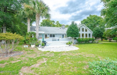 Spacious Coastal Retreat with Sunroom & Outdoor Entertaining on Brick Landing Plantation Yacht and Golf Club in North Carolina - for sale on GolfHomes.com, golf home, golf lot