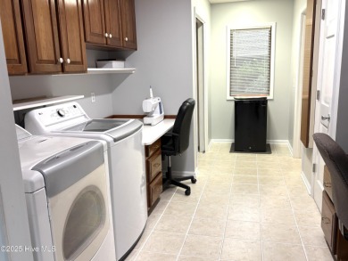 Spacious Coastal Retreat with Sunroom & Outdoor Entertaining on Brick Landing Plantation Yacht and Golf Club in North Carolina - for sale on GolfHomes.com, golf home, golf lot