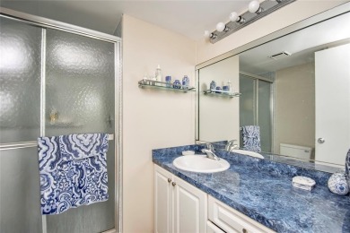 Wake up to tranquil water views in this stunning 2-bedroom on Sunrise Lakes Phase III in Florida - for sale on GolfHomes.com, golf home, golf lot