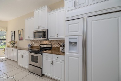 Halifax Plantation pool home; Move in now! The view is worth a on Halifax Plantation Golf Club in Florida - for sale on GolfHomes.com, golf home, golf lot