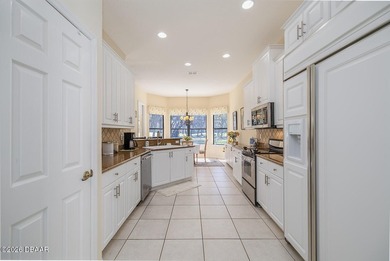 Halifax Plantation pool home; Move in now! The view is worth a on Halifax Plantation Golf Club in Florida - for sale on GolfHomes.com, golf home, golf lot