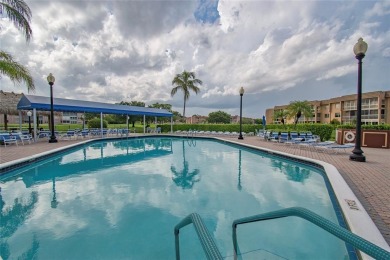 Wake up to tranquil water views in this stunning 2-bedroom on Sunrise Lakes Phase III in Florida - for sale on GolfHomes.com, golf home, golf lot