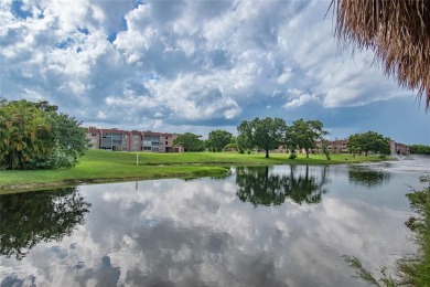 Wake up to tranquil water views in this stunning 2-bedroom on Sunrise Lakes Phase III in Florida - for sale on GolfHomes.com, golf home, golf lot