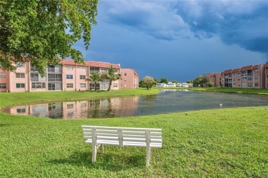 Wake up to tranquil water views in this stunning 2-bedroom on Sunrise Lakes Phase III in Florida - for sale on GolfHomes.com, golf home, golf lot