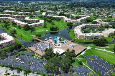 Wake up to tranquil water views in this stunning 2-bedroom on Sunrise Lakes Phase III in Florida - for sale on GolfHomes.com, golf home, golf lot