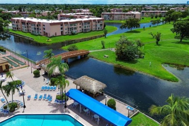 Wake up to tranquil water views in this stunning 2-bedroom on Sunrise Lakes Phase III in Florida - for sale on GolfHomes.com, golf home, golf lot