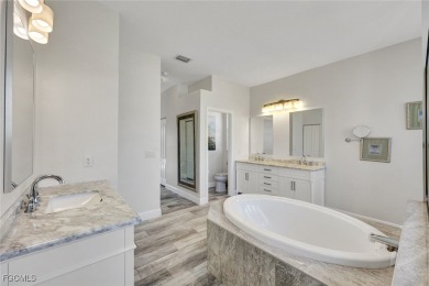 Welcome to your beautifully refreshed oasis in Fountain on Pelican Sound Golf and River Club in Florida - for sale on GolfHomes.com, golf home, golf lot