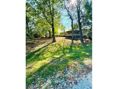 Nice weekend home on 3 LOTS (649, 650, and 651) on popular Buck on Linn Valley Lakes - Deer Trace Golf Course in Kansas - for sale on GolfHomes.com, golf home, golf lot