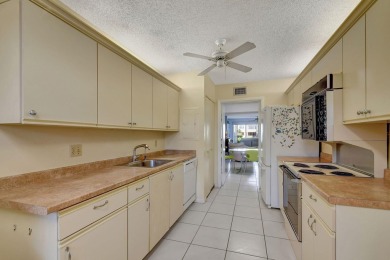 Welcome to this spacious first-floor condo, perfectly situated on Poinciana Golf Club in Florida - for sale on GolfHomes.com, golf home, golf lot