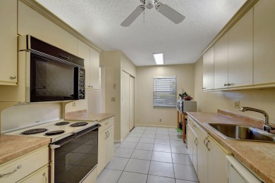Welcome to this spacious first-floor condo, perfectly situated on Poinciana Golf Club in Florida - for sale on GolfHomes.com, golf home, golf lot