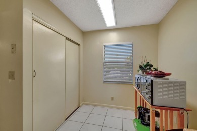 Welcome to this spacious first-floor condo, perfectly situated on Poinciana Golf Club in Florida - for sale on GolfHomes.com, golf home, golf lot