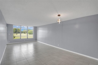 Stunning condo with expansive views of the golf course on Palm-Aire Country Club and Resort - Palms in Florida - for sale on GolfHomes.com, golf home, golf lot