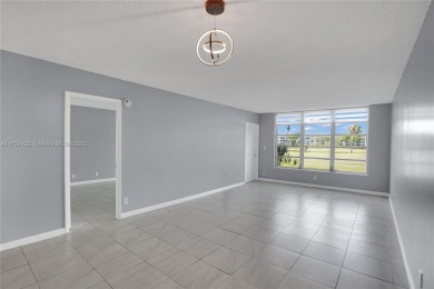 Stunning condo with expansive views of the golf course on Palm-Aire Country Club and Resort - Palms in Florida - for sale on GolfHomes.com, golf home, golf lot