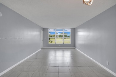 Stunning condo with expansive views of the golf course on Palm-Aire Country Club and Resort - Palms in Florida - for sale on GolfHomes.com, golf home, golf lot