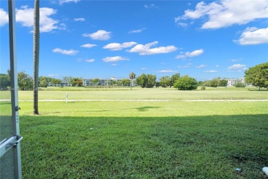 Stunning condo with expansive views of the golf course on Palm-Aire Country Club and Resort - Palms in Florida - for sale on GolfHomes.com, golf home, golf lot