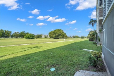 Stunning condo with expansive views of the golf course on Palm-Aire Country Club and Resort - Palms in Florida - for sale on GolfHomes.com, golf home, golf lot