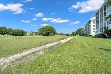 Stunning condo with expansive views of the golf course on Palm-Aire Country Club and Resort - Palms in Florida - for sale on GolfHomes.com, golf home, golf lot