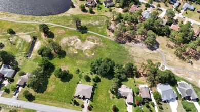 Buy a beautiful water view lot and build your dream home in one on Harbour Point Golf Club in North Carolina - for sale on GolfHomes.com, golf home, golf lot