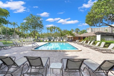 Stunning condo with expansive views of the golf course on Palm-Aire Country Club and Resort - Palms in Florida - for sale on GolfHomes.com, golf home, golf lot