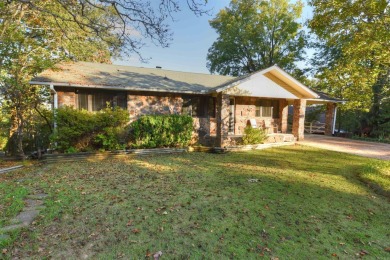 This charming partial lakeview home offers an inviting retreat on Mountain Ranch Golf Club in Arkansas - for sale on GolfHomes.com, golf home, golf lot