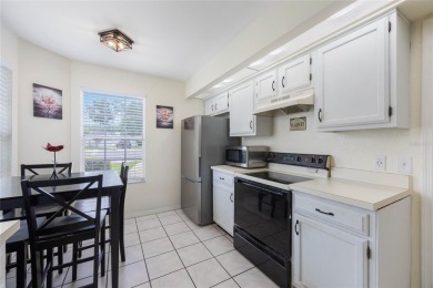 Experience breathtaking lake views from this adorable 3 bedroom on Mayfair Country Club in Florida - for sale on GolfHomes.com, golf home, golf lot